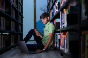 student sitting in the library